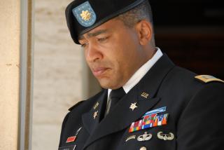 Maj. Angel Mesa, a U.S. Army Africa operations officer, bows his head in deep thought during a prayer at the North African American Cemetery and Memorial in Tunisia
