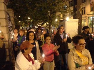 A crowd of Unitarian Universalists walks in a candlelight vigil honoring the life of Freddie Gray.