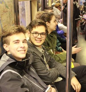 Youth Deans Max and Martin ride the subway during the UU-UNO's 2017 Spring Seminar