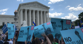 The Supreme Court is in the background, with protestors holding "No Muslim Ban Ever" signs in the foreground