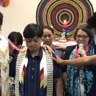 New UUCP leaders the Rev. Arman Pedro (left), vice president and church administrator, and the Rev. Tet Gallardo (center), president and executive minister, are blessed by the community at a ceremony in February 2020.