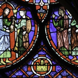 Stained glass detail from a window in the Sainte Chapelle, Paris, showing Judas handing over a bag of silver.