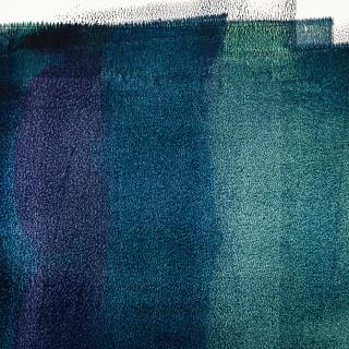 Vertical swaths of paint, in deep blues and indigos, on a wall.