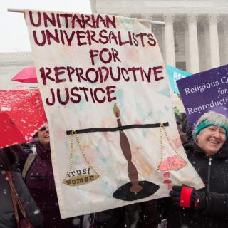 UUs holding repro justice signs at a rally outside Supreme Court