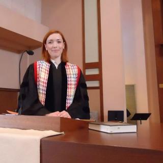 Rev. Darcy Roake at the pulpit of Emerson UU Church in Houston, TX