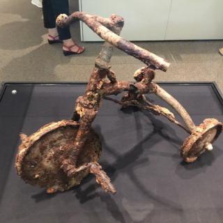 Photo of a child's tricycle remaining after the dropping of the atom bomb on Hiroshima Aug. 6, 1945 at the Hiroshima Peace Museum.
