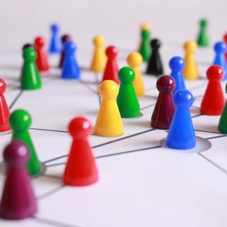 Game pieces of different colors in a network