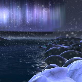 Northern_Lights_Water_Snow-covered_Rocks-Flickr