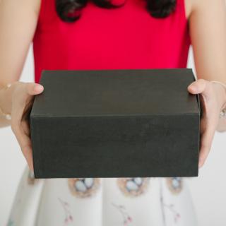 person holding a black box