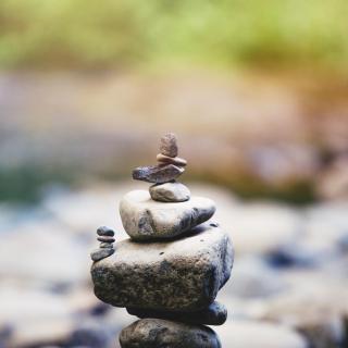 A stack of stones, with smaller stacks (of smaller stones) jutting off