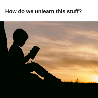 a child reading a book is silhouetted against a sunrise 